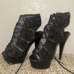 Black lace-up platform heels with a 5" heel