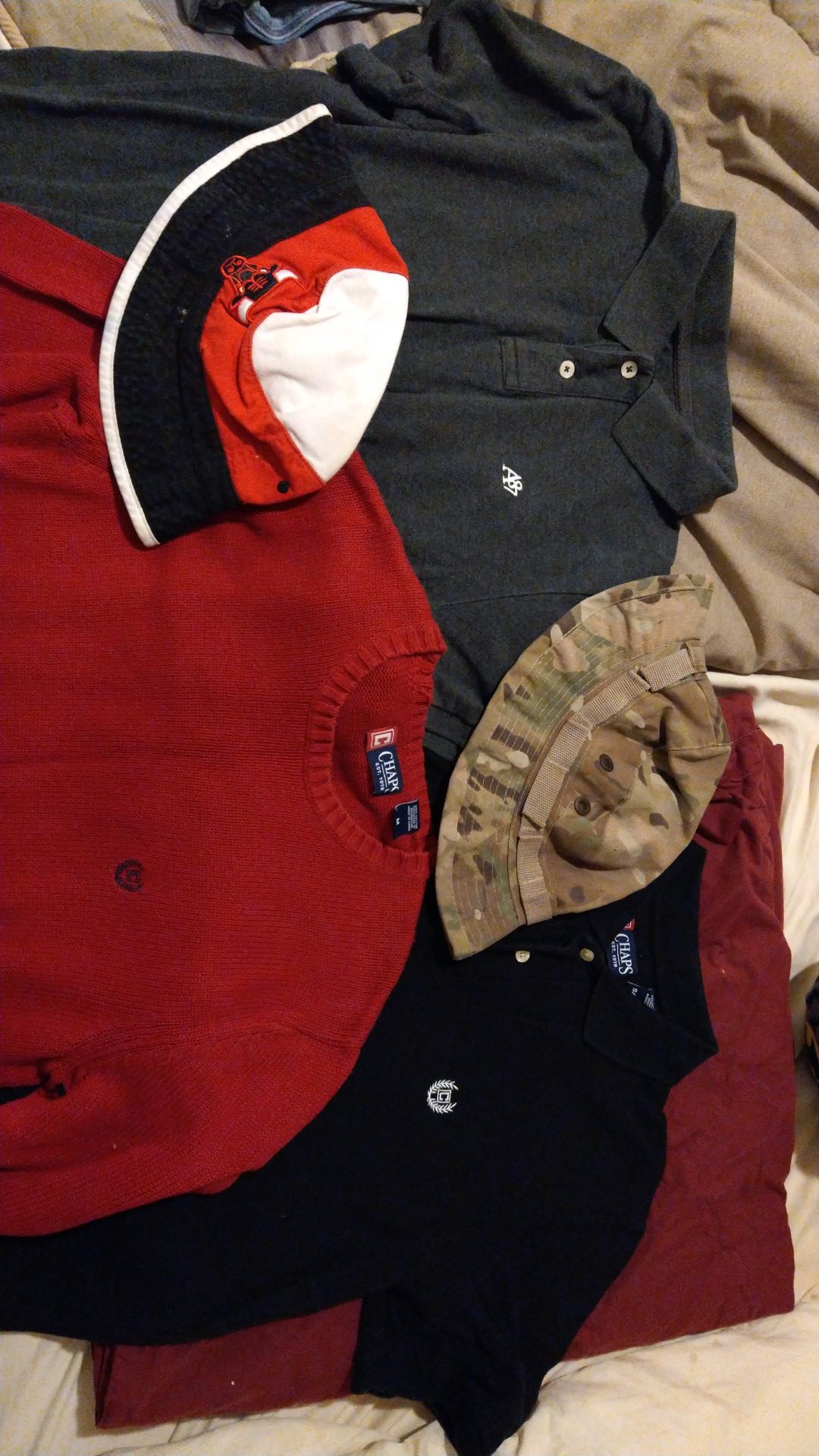 Large and medium size clothes with bulls and camo hats