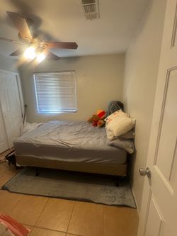 Queen bed, mattress, box spring, and bottom frame.