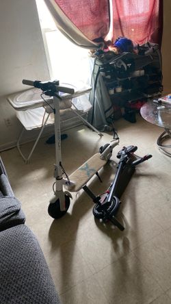 Two electric scooters and charger