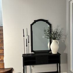 Black console table with mirror