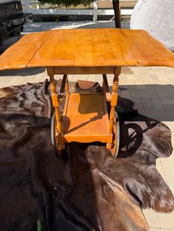 Rustic wood cart with rolling wheels