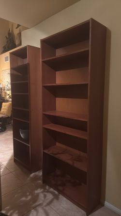 Two brown sturdy bookcases with adjustable shelves (both for $125)