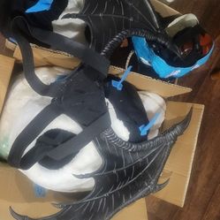 Misc furry stuff, strap on dragon wings & decorated Dino masks
