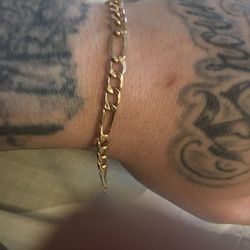 14 Kt solid gold figaro bracelet wieght is 8 grams