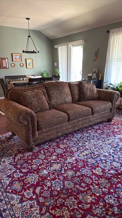 94” Earth-toned paisley patterned sofa