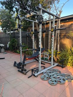 MIKOLO OLYMPIC POWER CAGE SQUAT RACK WITH OLYMPIC WEIGHTS AND BENCH