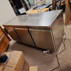 Commercial six foot stainless steel food prep table with under counter refrigerator