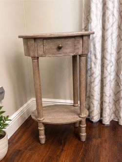 Round wood accent table with drawer