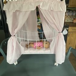 Baby doll pink canopy play crib. It rolls. doll not included. cash only. Everett/Melvin Avenue pick up area. Small stain on mattress pad and a small p