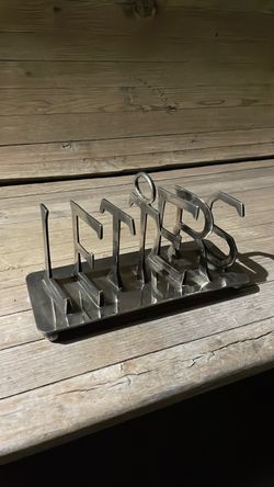 Vintage stainless steel letter holder.