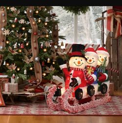 29 in. Lighted Snowman Family on Sled in Winter Coats, Outdoor Christmas Yard Decoration