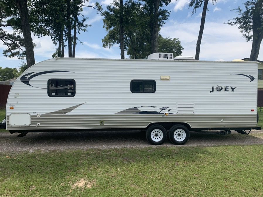 2012 Joey travel trailer 28ft bunk house fully self-contained everything works no leaks Queen private bedroom in front bunkbeds and rare sofa makes a