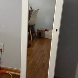 Mirror with jewelry storage