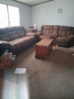 Brown Living room couch and love seat.Both recliner. Lovd seat has phone charger under middle arm rest.
