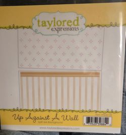 Taylored Expressions up against a wall stamp