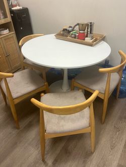 4 used chairs with broken table