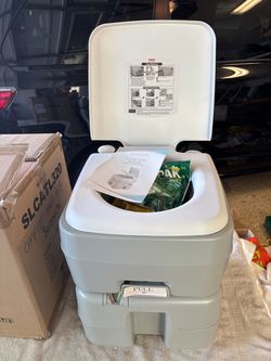 Portable toilet. New/never used.