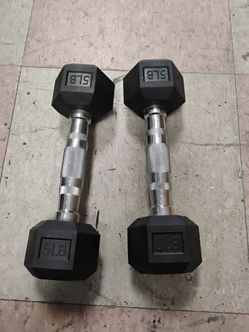 Rubber-encased hexagonal dumbbells weighing 5 pounds each