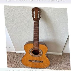 Acoustic Guitar Wonderful Sound and Traditional Build guy successful