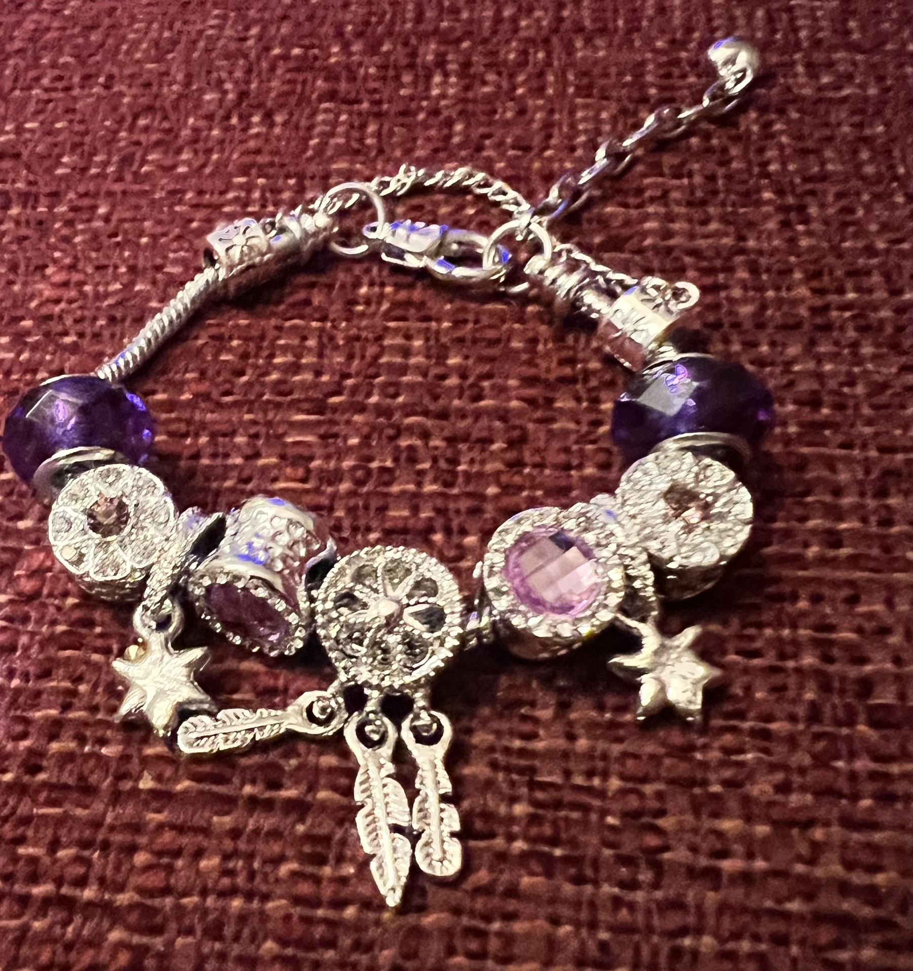 Charm bracelet with lock and charms