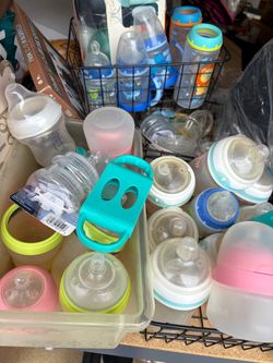 Baby bottles and sippy cups with extra pieces