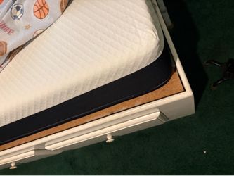 White solid wood twin bed with drawer