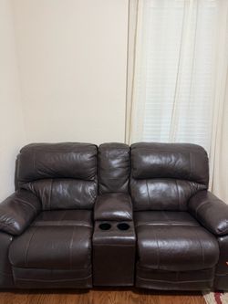 Brown leather loveseat