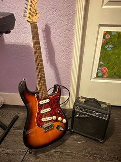 Electric guitar ( including stand and amp)