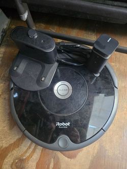 Roomb vacuum irobot with charging dock and room divider accessor, needs troubleshooting.