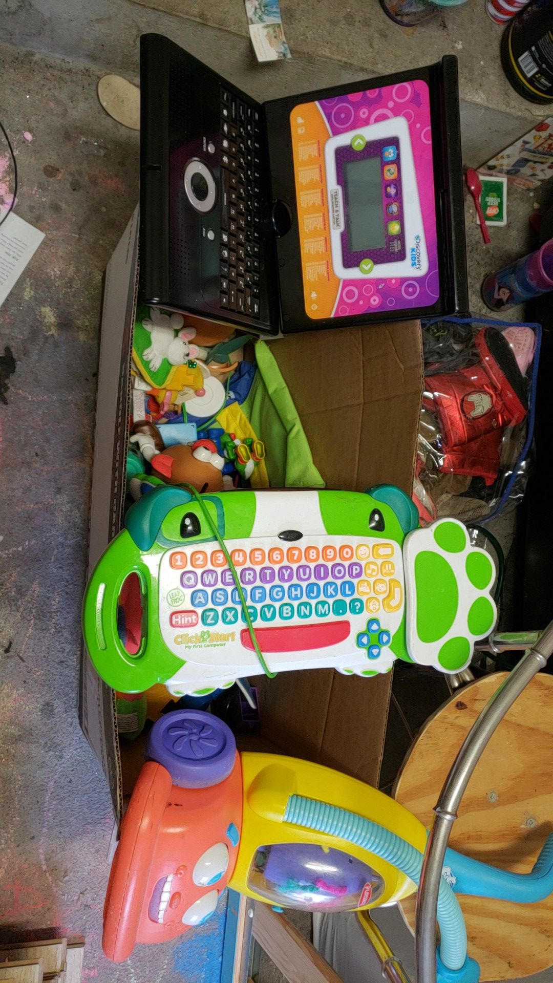 Box of random kids toys includes a leap frog click and start computer discovery kids lap top mr potato head a push vacuum