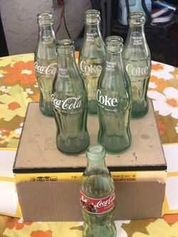 Emptyvintage glass Coca-Cola bottles 1998