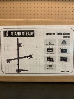 Triple monitor stand new in the box
