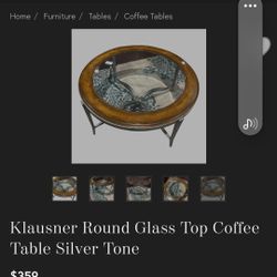 Round glass top coffee table. Real wood and silver tone. 