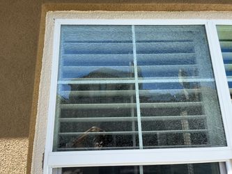 Broken Double-Pane Window with White Frame