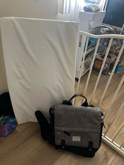 Diaper changing pad and diaper bag