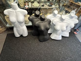 Set Of 7 Clothing Displays In Gently Used Condition