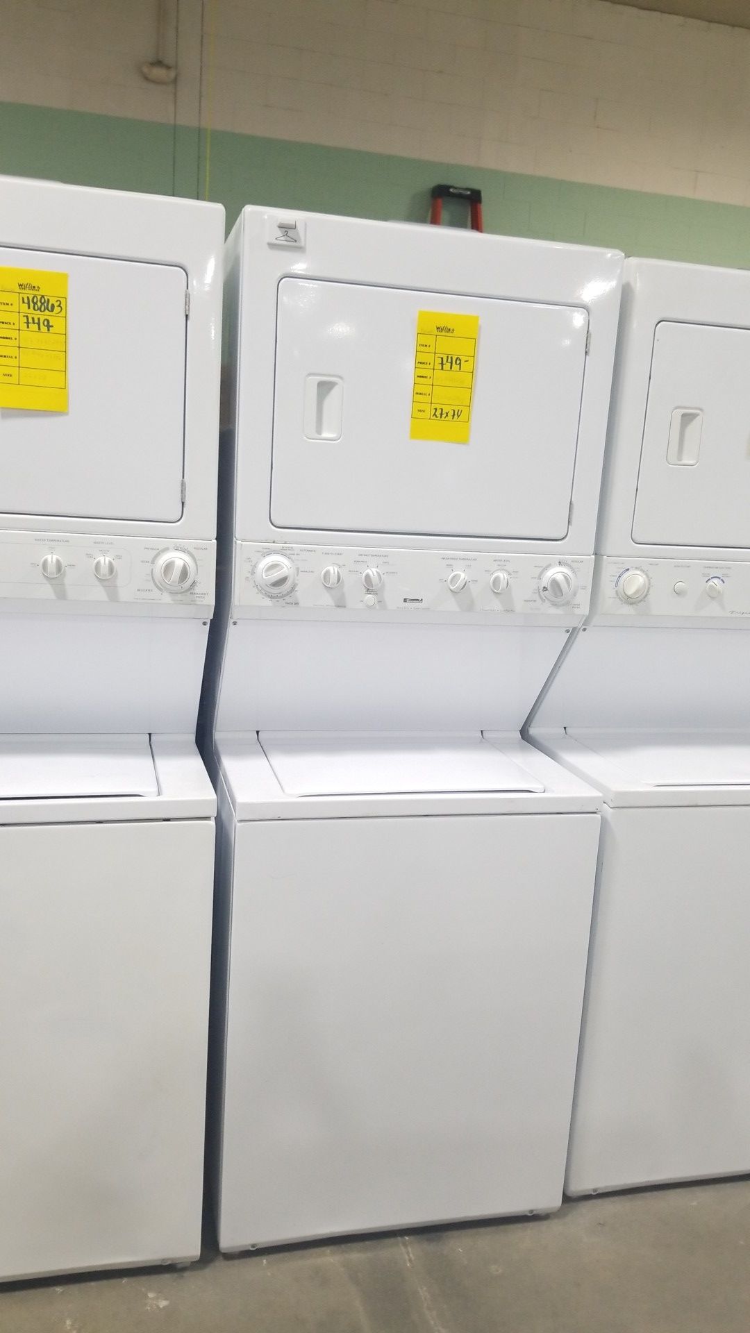 Kenmore 27x74 washer/dryer electric stackable