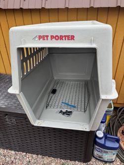 Large plastic airline dog crate