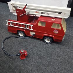 Vintage Tonka snorkel fire truck with some accessories apparently you can hook the hose up to the plug and the water will go into the truck up the ste