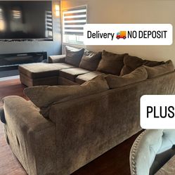 Dark brown U-shaped sectional couch with Chase