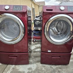 Red stainless Samsung  washer and gas dryer set with pedestals