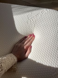 Luxe twin bed set up: mattress with thick Tempur-pedic topper, protector case, and IKEA bed frame