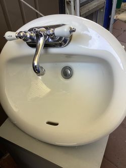 Bathroom sink,faucet and water line.