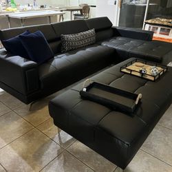 $0 Down!  New Sectional W Large Ottoman.  Black Or White Leather.  117” X 69”.  Free Delivery!