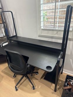 Nice clean work/study desk with chair.
