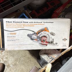 Fiber cement saw with auto guard