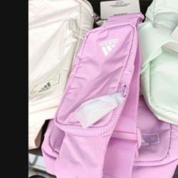 ADIDAS crossbody Backpack.  New. Multiple Compartments.  Separate Glasses/cellphone Case. New. $20 Each 