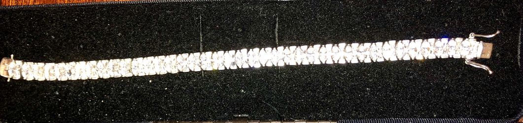 STERLING SILVER TENNIS BRACELET WITH DIAMONDS. Marked 925