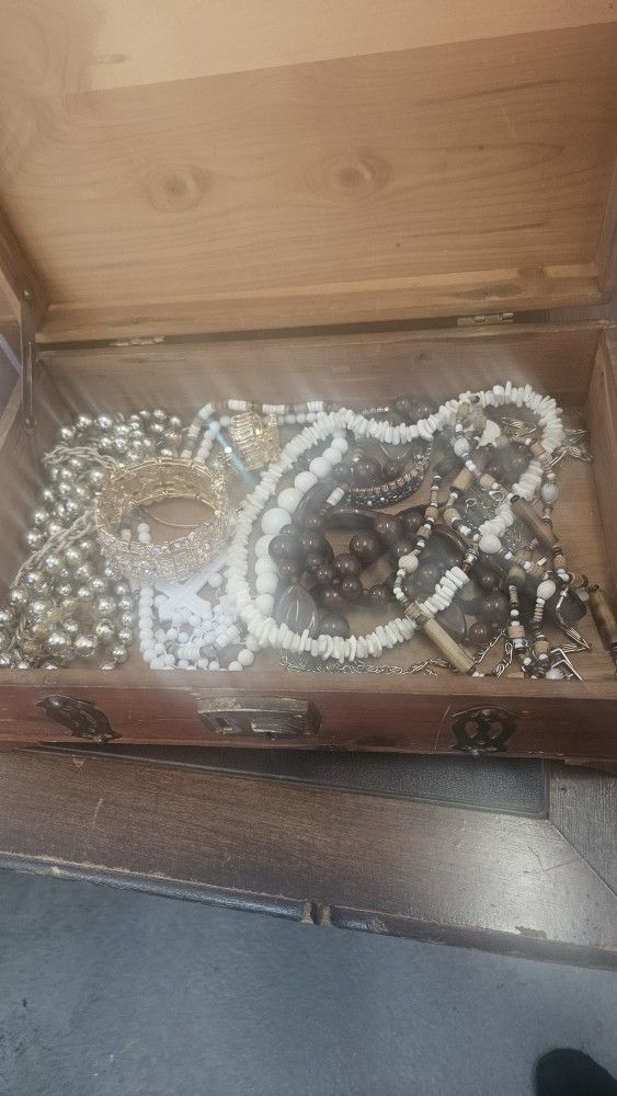 Wooden jewelry box filled